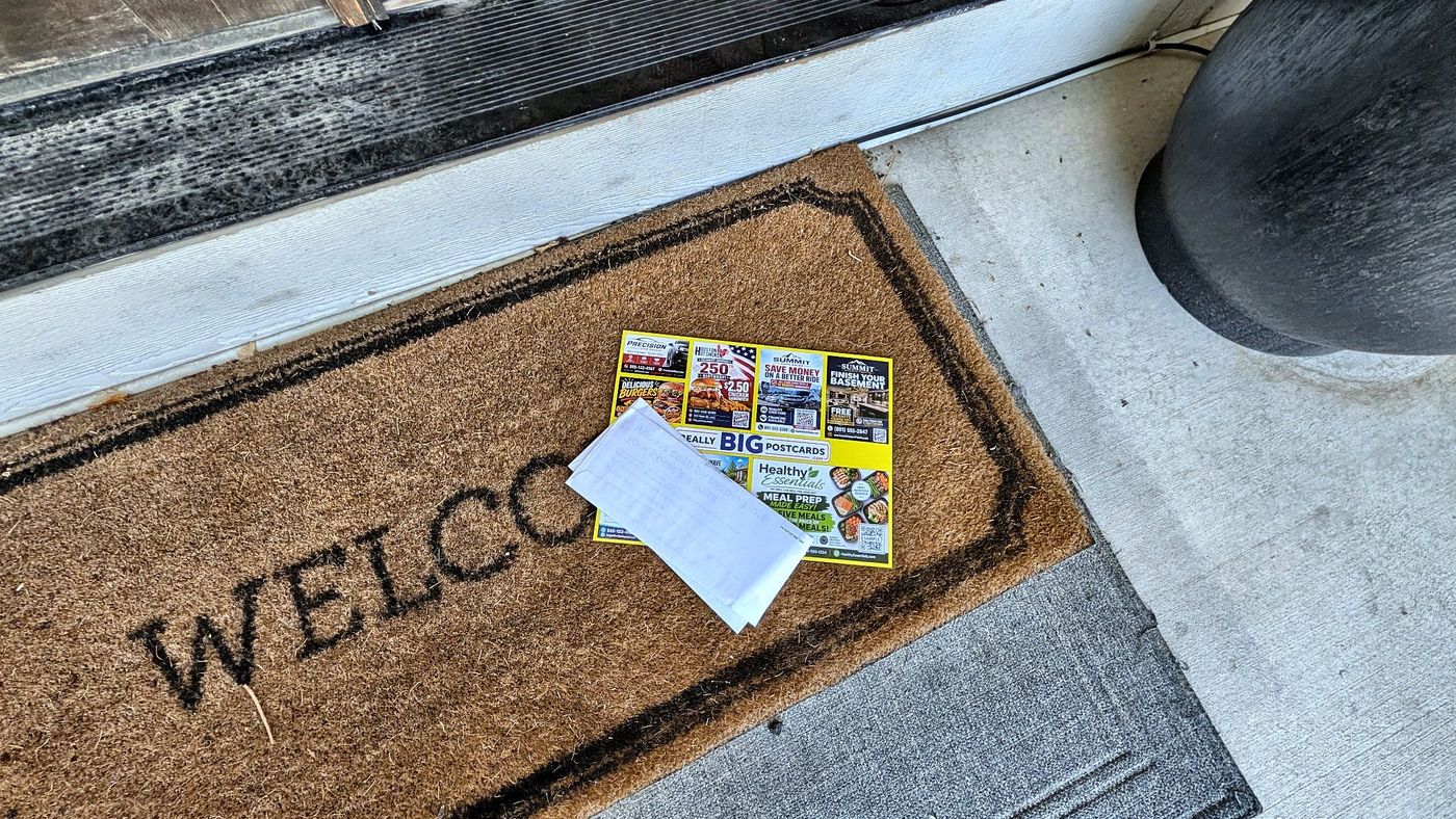 A Really Big Postcard delivered on a front doormat